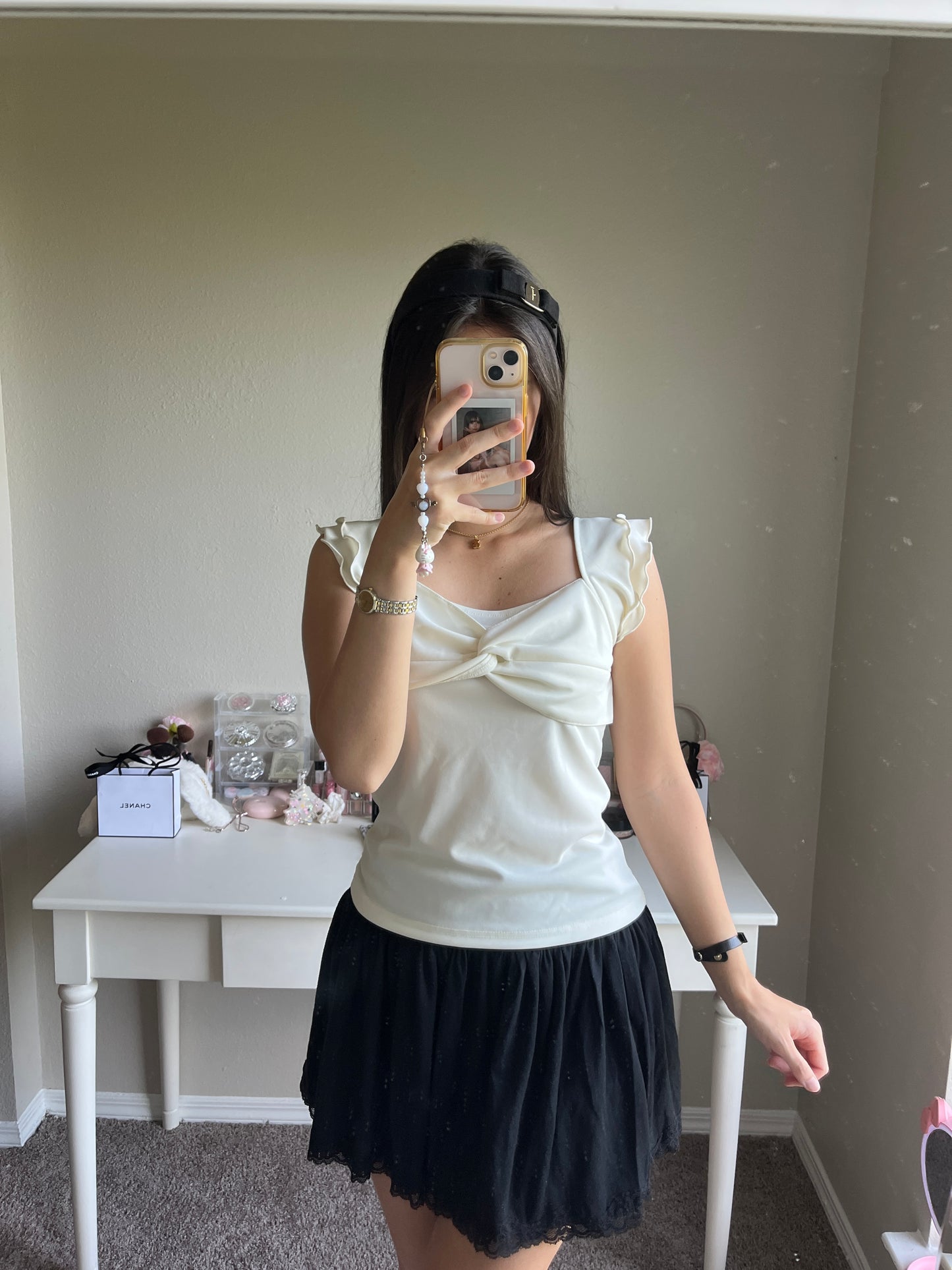 cream ruffle accent top