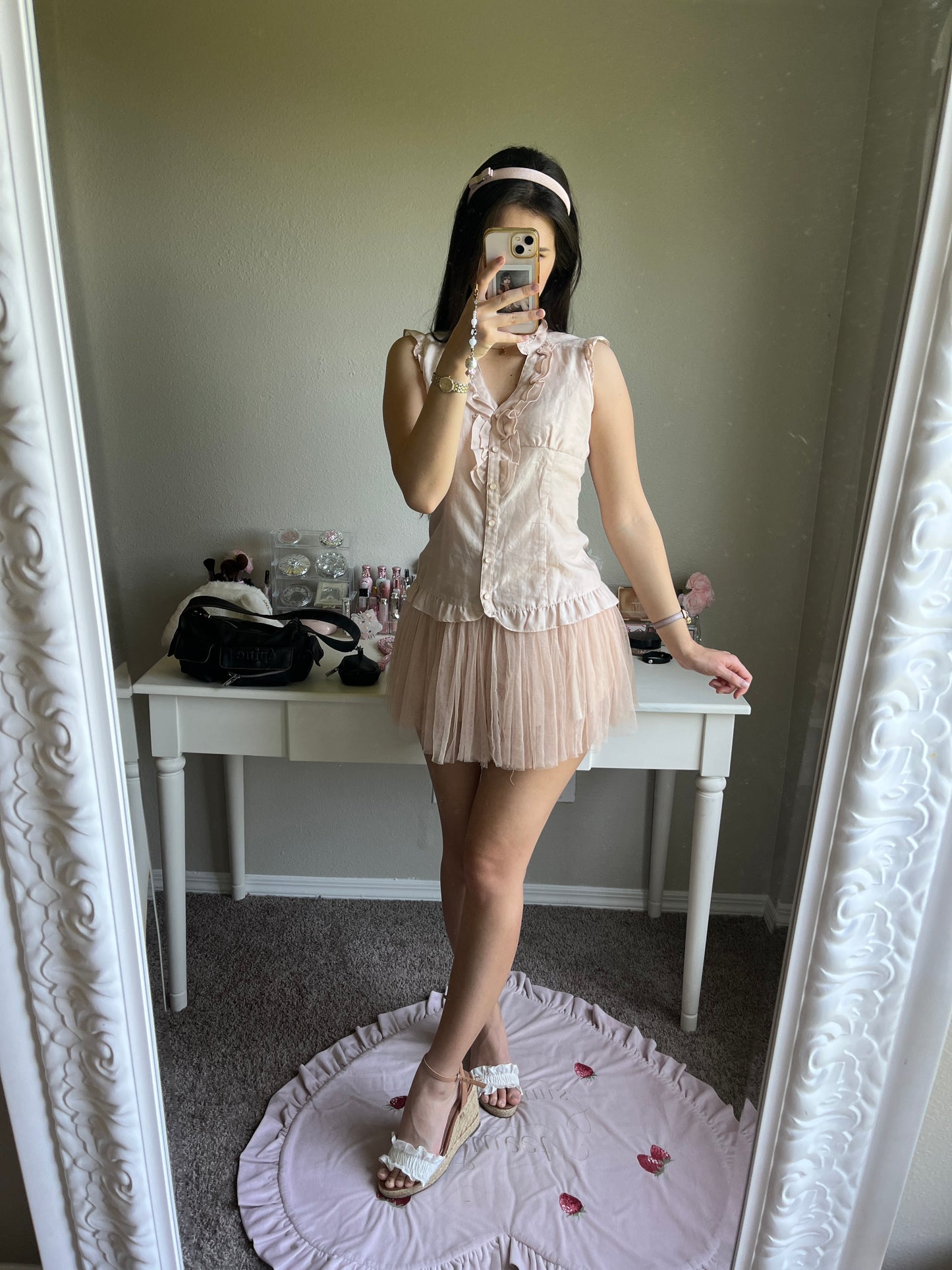 soft pink sleeveless blouse