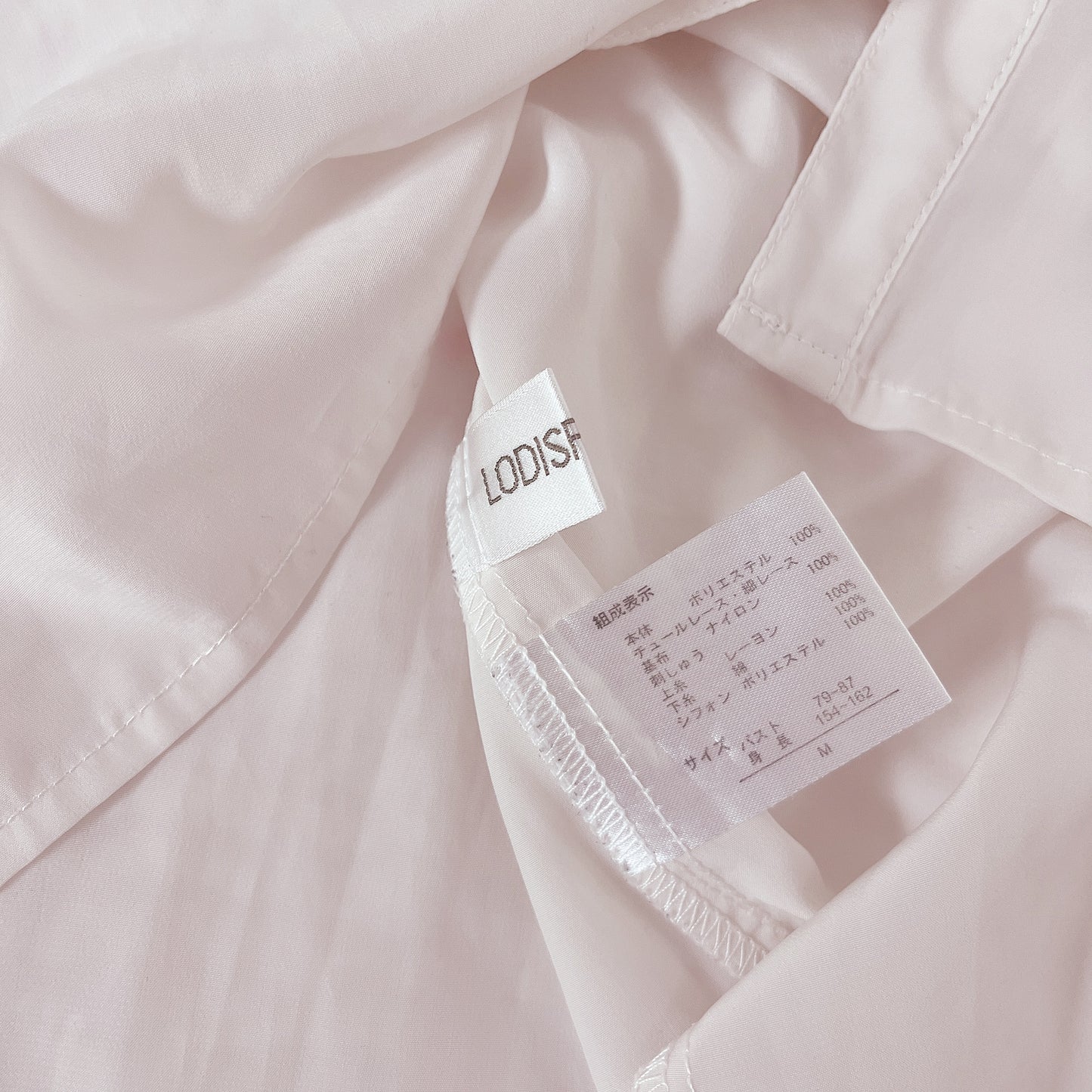 off-white pearl accent babydoll blouse