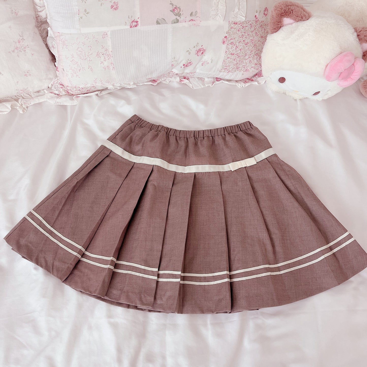 tan pleated ribbon accent skirt