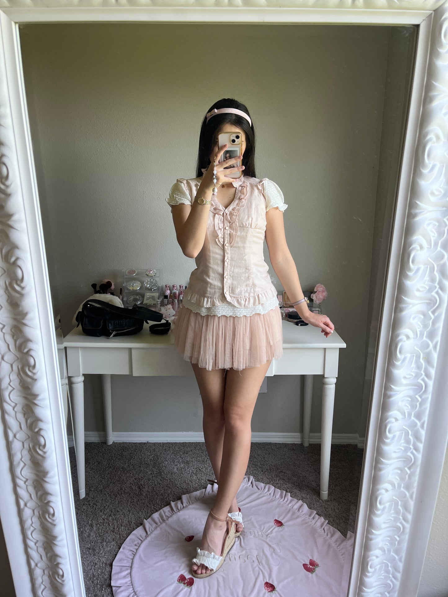 soft pink sleeveless blouse