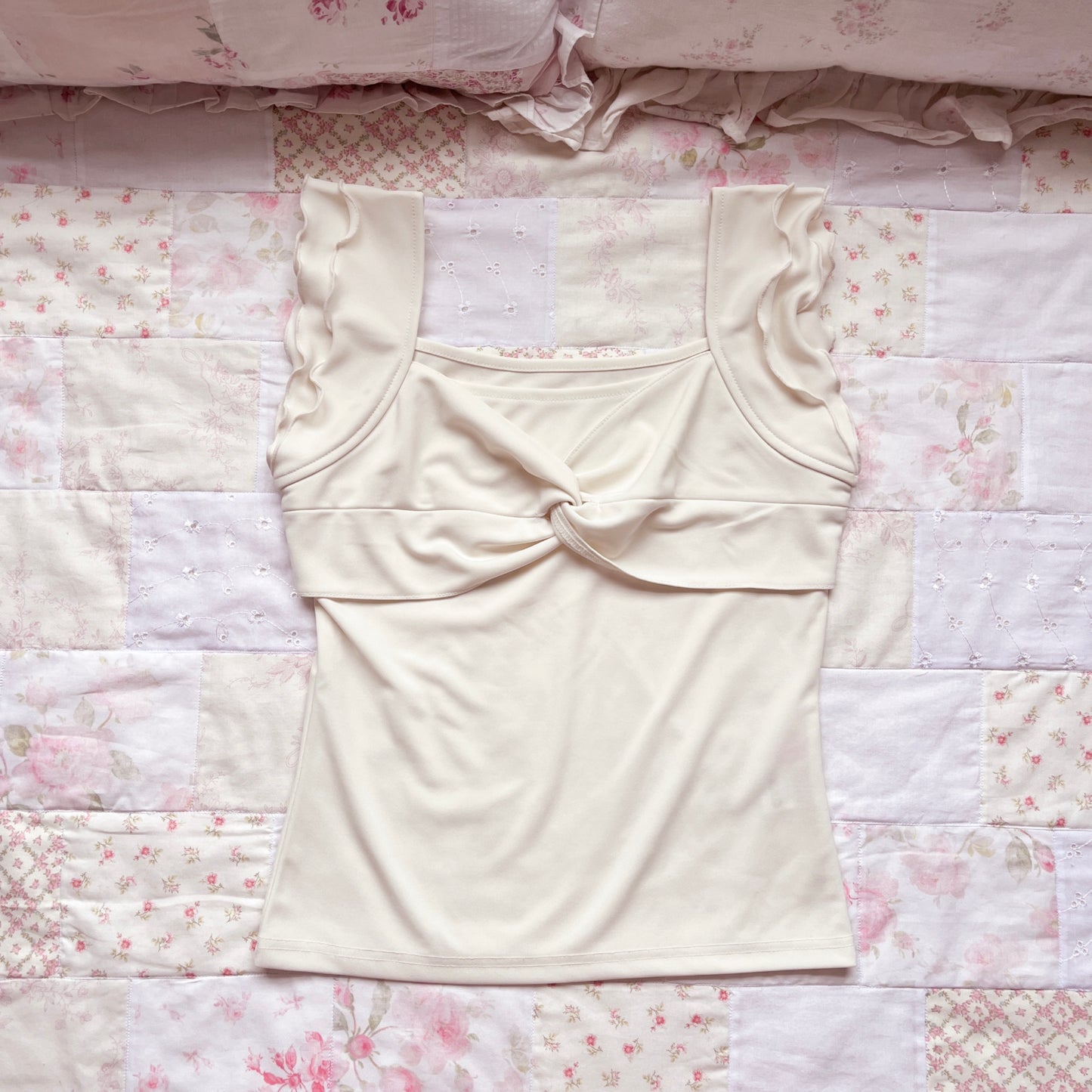cream ruffle accent top