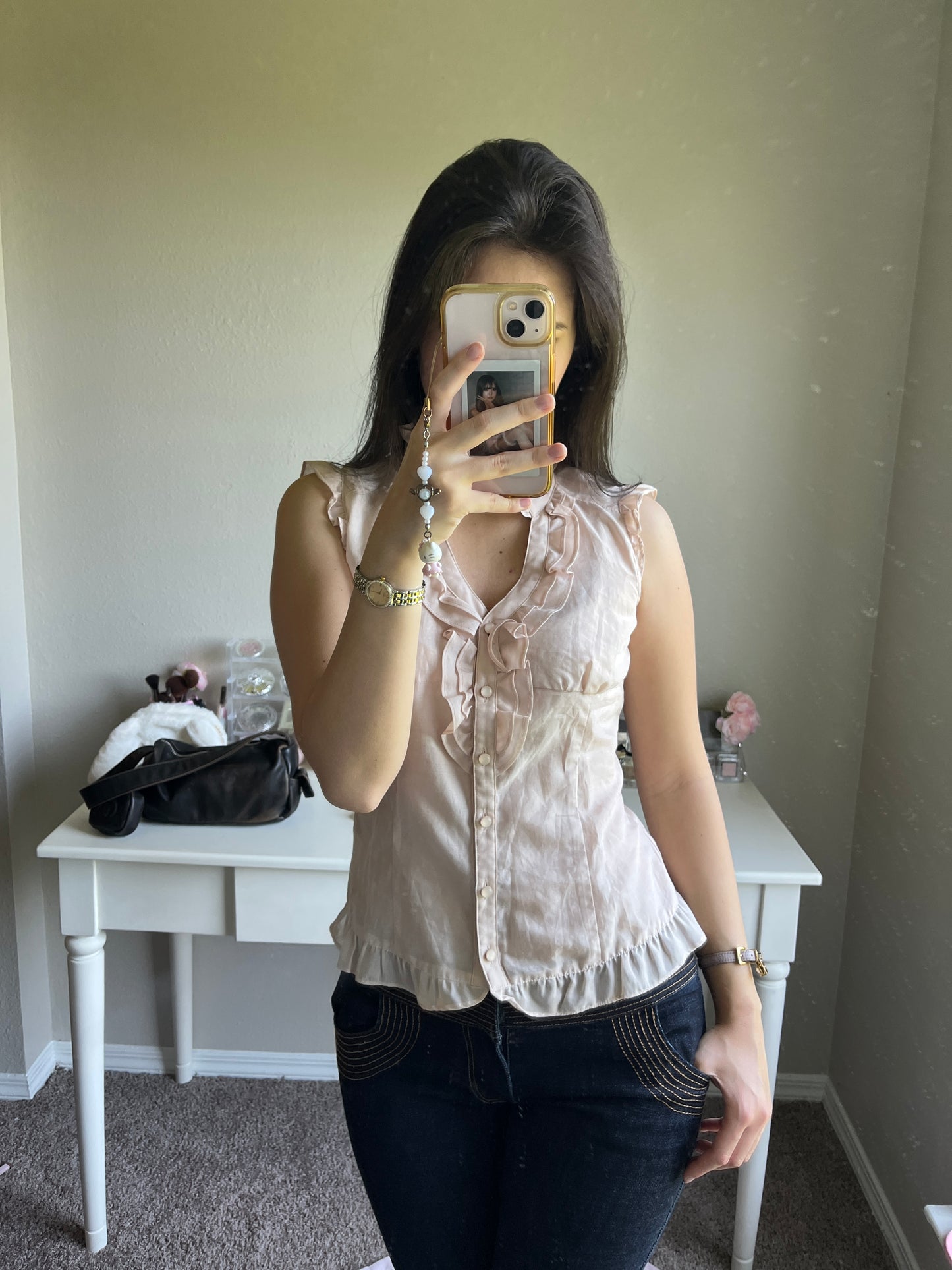 soft pink sleeveless blouse