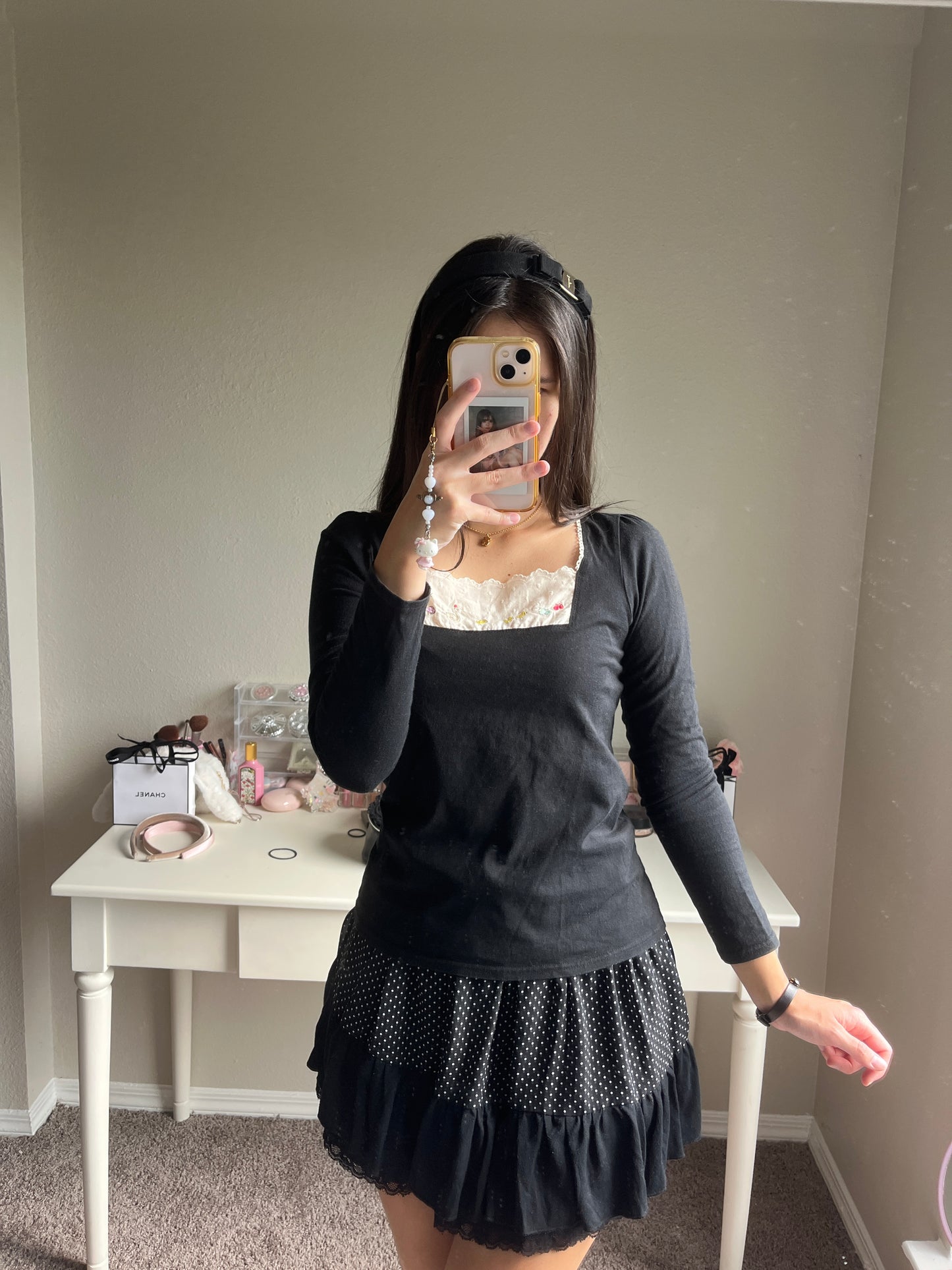 black embroidery accent top