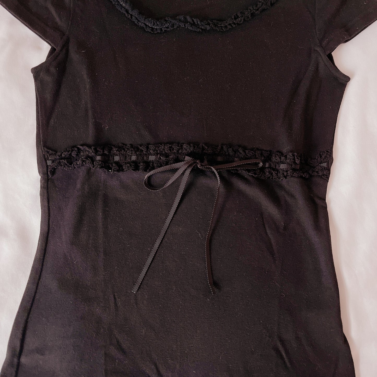 ribbon accent black knit top