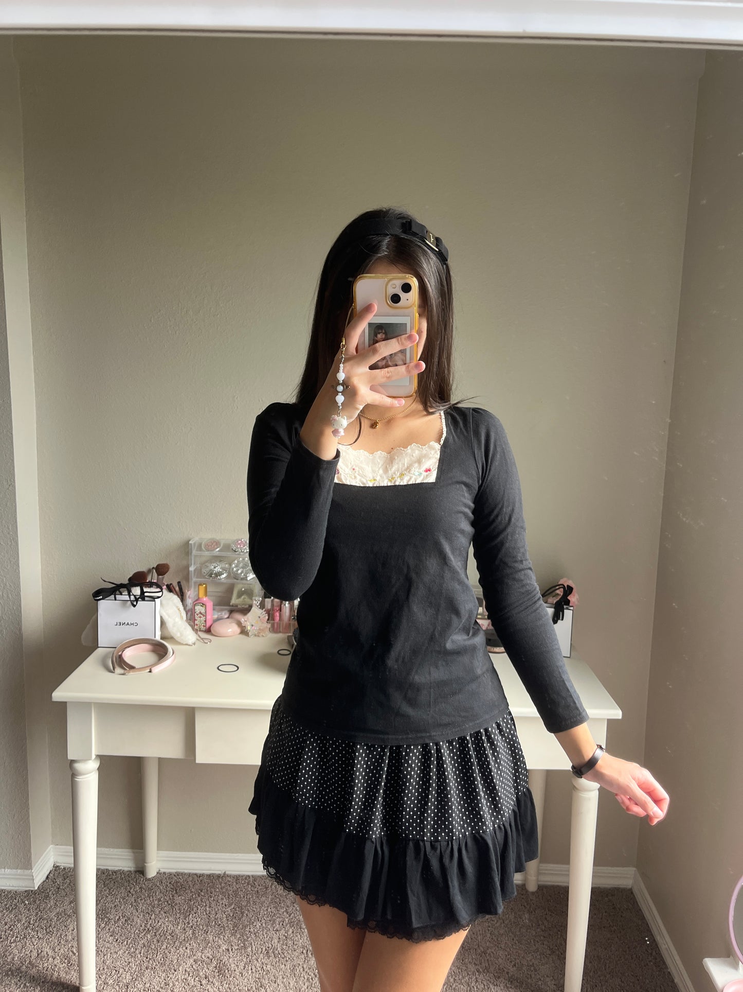 black embroidery accent top