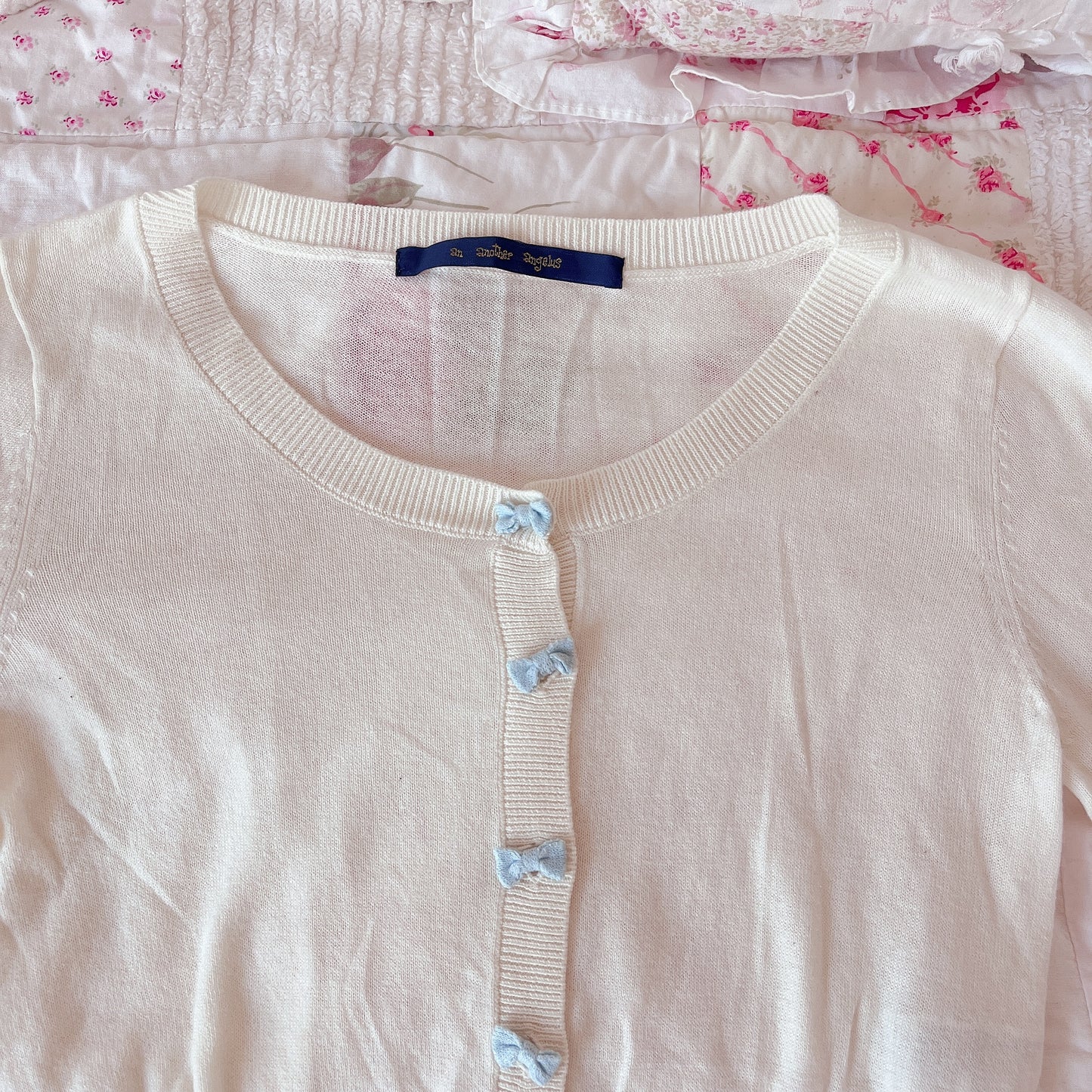 blue ribbon accent cream cardigan
