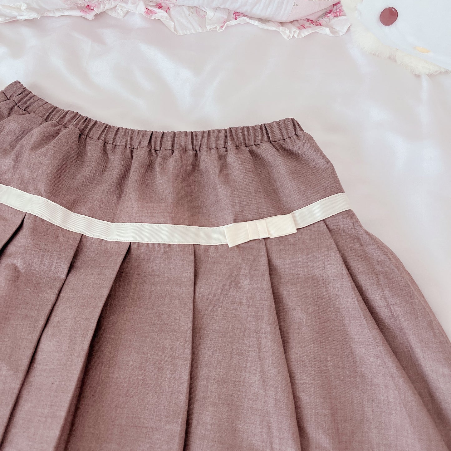 tan pleated ribbon accent skirt
