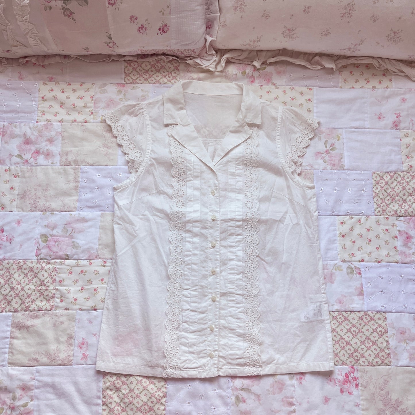 white sleeveless blouse