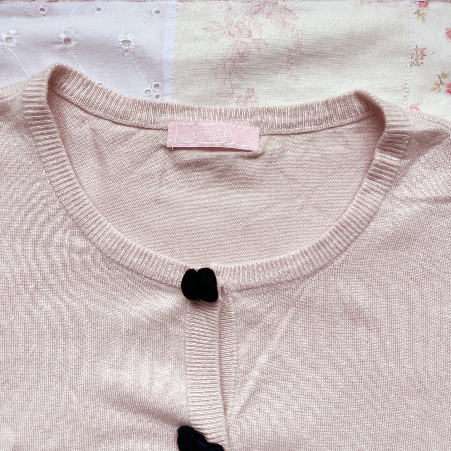 soft pink and black cardigan