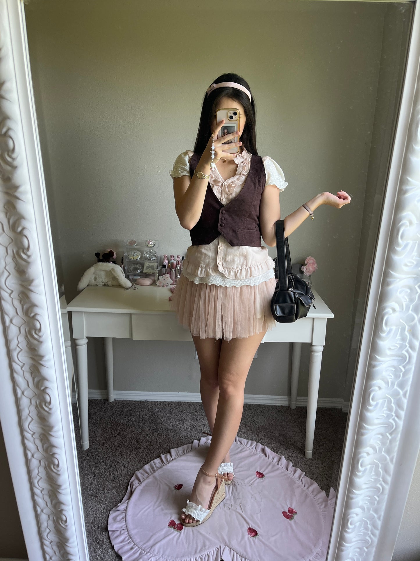 soft pink sleeveless blouse