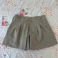 tan pleated shorts