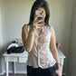 soft pink sleeveless blouse