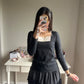 black embroidery accent top