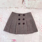 button accent tweedy skirt