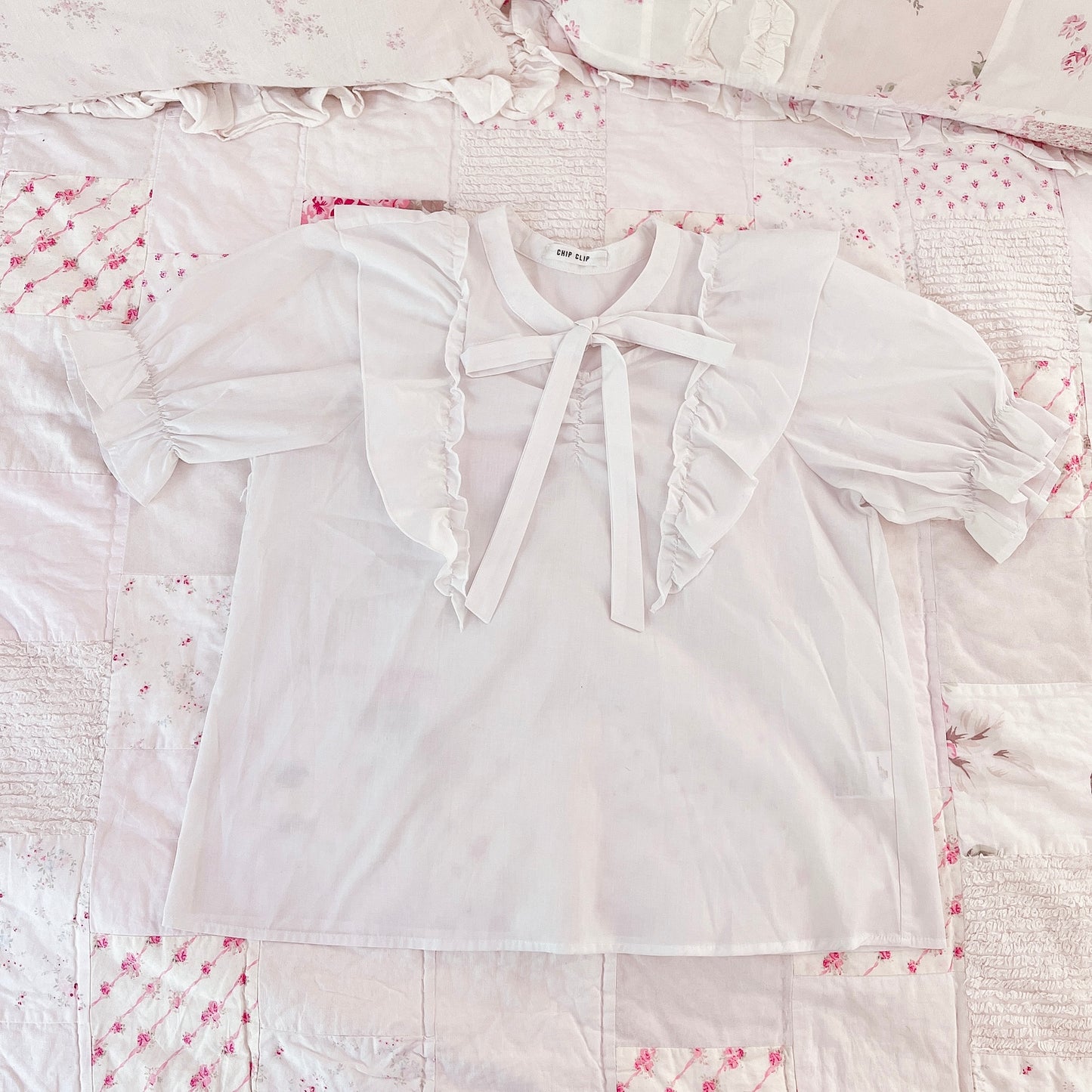 white ribbon tie blouse