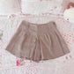 tan pleated shorts