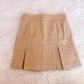 tan box pleated skirt