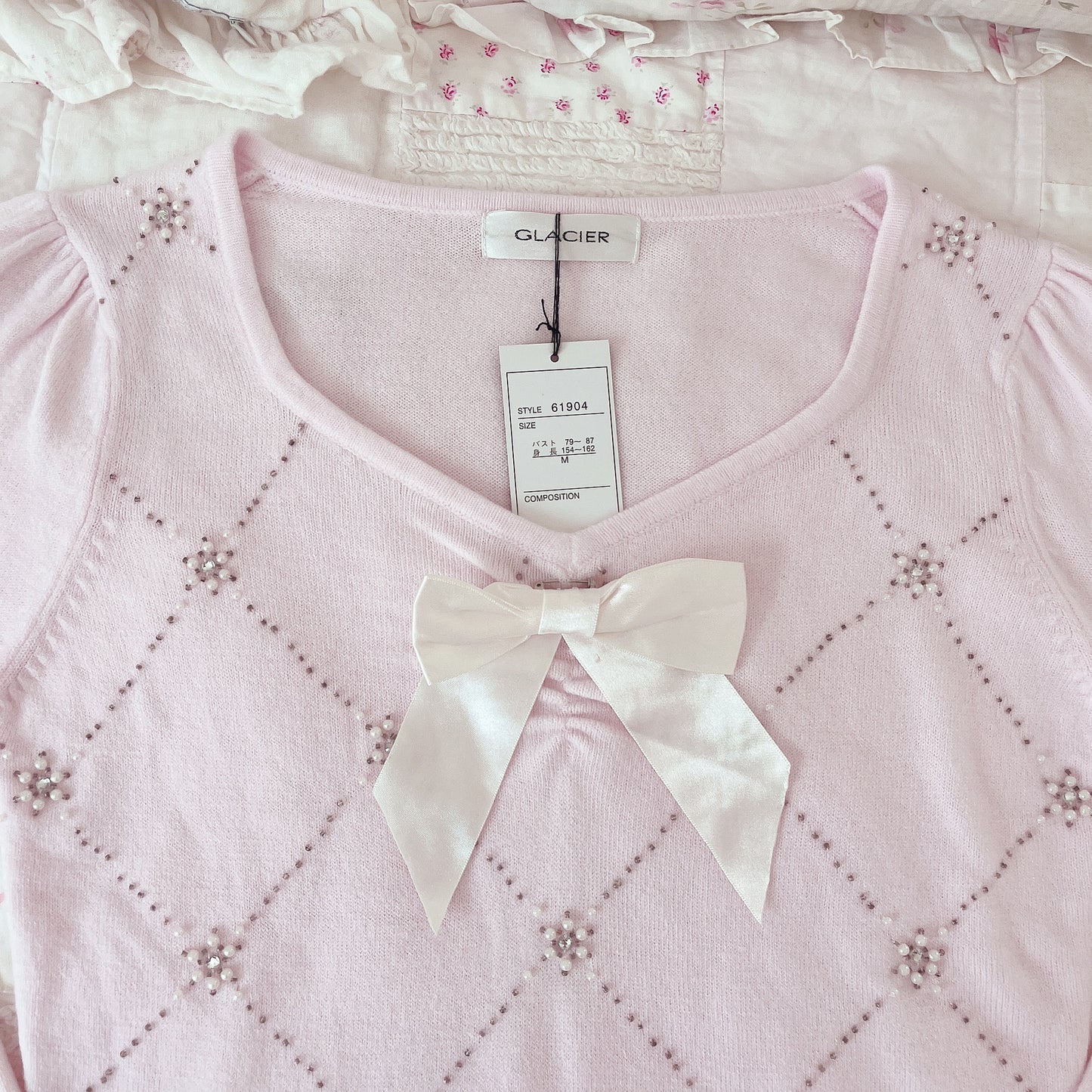 pink ribbon accent sweater