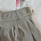 tan pleated shorts