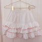 white hibiscus trim skirt